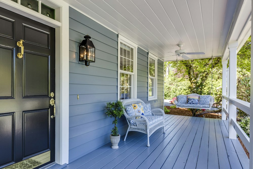 Blue porch beneath a deep roof overhang