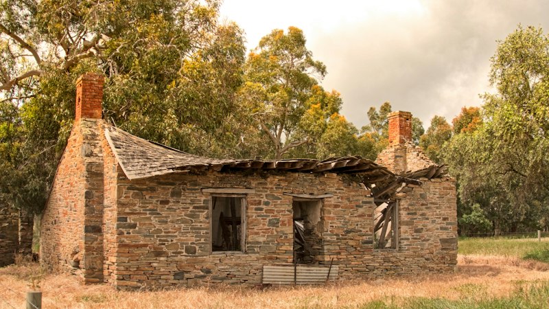 Old stone farmhouse under a pitched roof